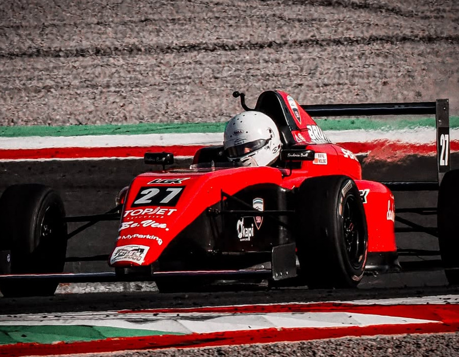 Rafal Wolosz's #27 single-seater at speed through a corner